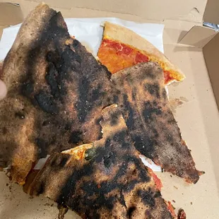 Extremely burnt and bad tasting pizza. Not like Rocco's.