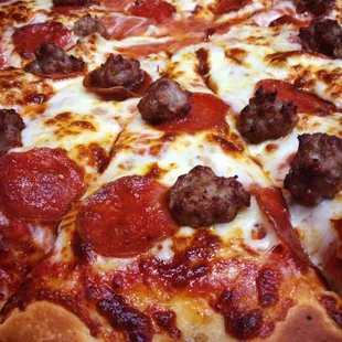 Rocco's Pizza - dough made daily, homemade sauce, freshly shredded provolone cheese, pepperoni &amp; fresh sausage