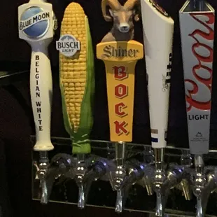 a row of beer taps
