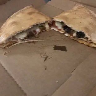 Calzone with sausage, pepperoni, onion and bell peppers