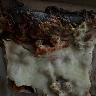 a piece of pizza in a box