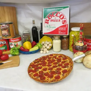 a pepperoni pizza and ingredients