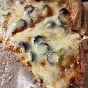 Deep dish with black olives and green pepper