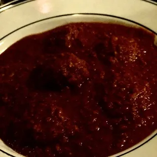 Spinach ravioli with meat sauce