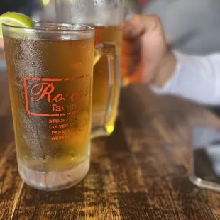 two glasses of beer on a table