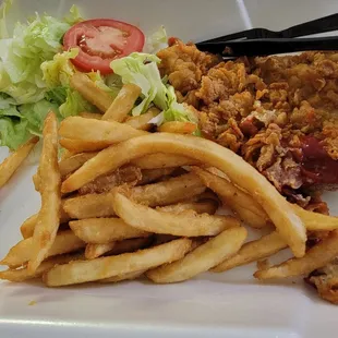 No gravy and more breading then meat. Fries are soaked in salt and cold.