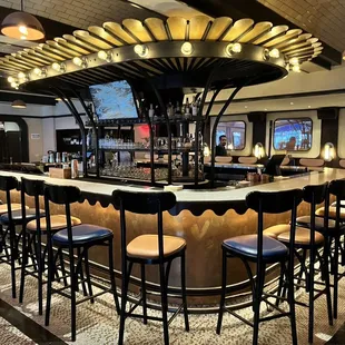 a bar with chairs and tables