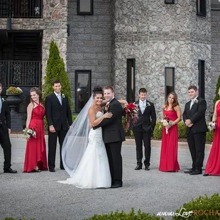 Castle Post, Versailles, KY Red and black accent this wedding party beautifully!