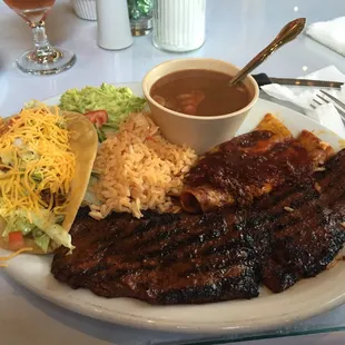 Fajitas with enchiladas and one crispy taco