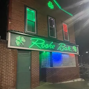 the front of the building lit up for st patrick's day