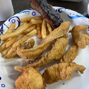 Catfish, rib, hush puppy, fries - this is portion AFTER I split the meal with  my friend.