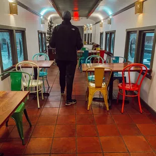 Cute narrow train car with plenty of seating