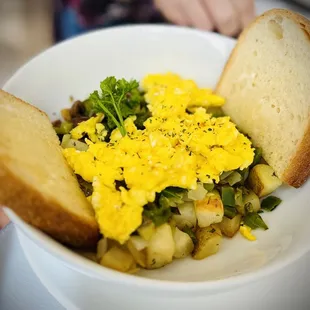 a bowl of eggs and bread