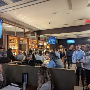 a large group of people sitting at tables