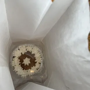 a cupcake in a paper bag