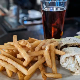 a plate of fries and a burrito