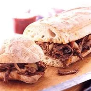 Smokehouse Sandwich --Brisket with peppers and onions on grilled ciabatta