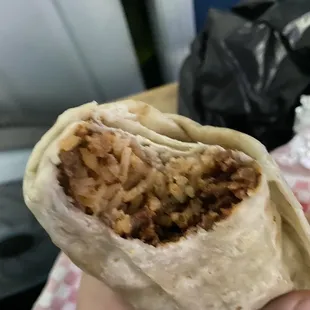 Inside the Asada Burrito. Meat was good, tender, definitely softer and more cut down then I'm used to.