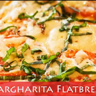 Margharita Flatbread: Thin sliced vine-ripened tomatoes, Italian seasoned olive oil, mozzarella and finished with oregano.