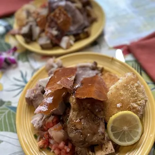 ows two plates of food on a table