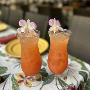 ows two cocktails on a table