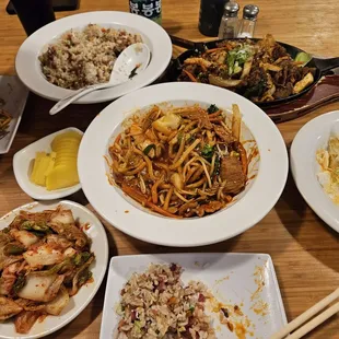 Pork yaki udon, bacon fried rice, beef bulgogi, kimchi, pickle radish, and salad.