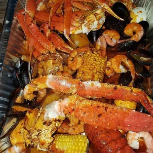 crab legs, corn, mussels, and mussels