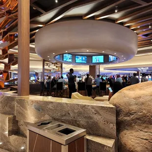 people sitting at tables in a restaurant