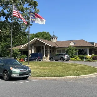 this is the club house with the 3 flags in front