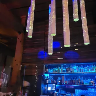 a view of a bar with blue lights