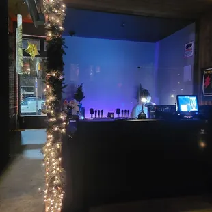 a bar decorated with christmas lights