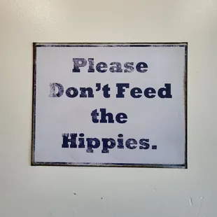 please don&apos;t feed the hippies sign