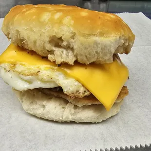 a biscuit sandwich with cheese and an egg