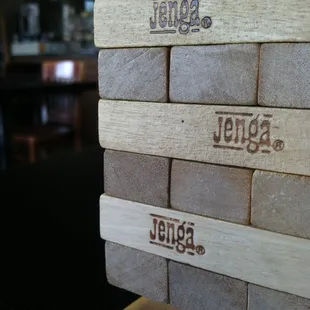 Play a game of Jenga while you patiently await a Cheese Crispy!