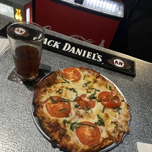 a pizza and a glass of beer