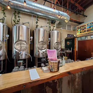 a row of stainless steel tanks