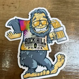 a sticker of a man holding a beer