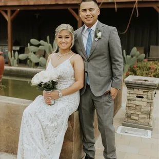 a bride and groom posing for a picture