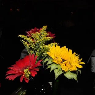 two vases of flowers on a table