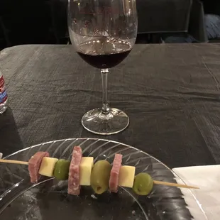 Medley of cheese, olives and salami paired with 2015 Estate Barbera