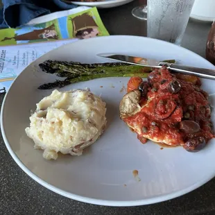 Chicken cacciatore. The asparagus are a little burnt, the mashed potato is actually tasty and chicken is okay.