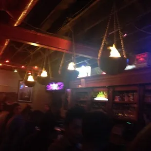 a group of people sitting at a bar