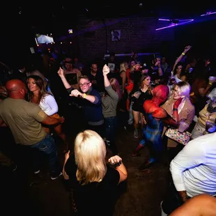 ows a group of people dancing