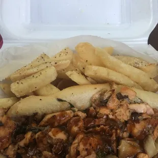 Jerk salmon cheesesteak with spinach, onions, and mayo