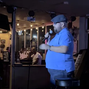  man singing into a microphone