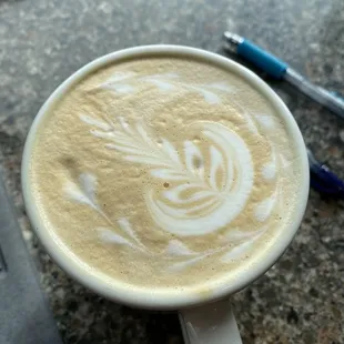Beautiful latte art on a white chocolate mocha!