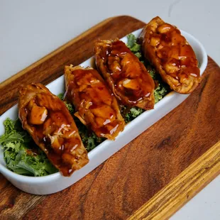 ree pieces of meat in a dish