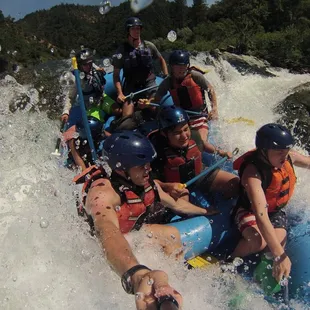 Selfie Stick perspective of whitewater rafting