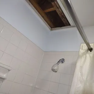 Uncovered ceiling on top off shower