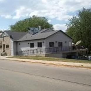 a house and a car parked on the side of the road